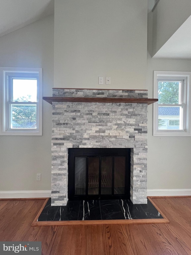 8107 Chester St, Takoma Park, MD 20912 - detailed view of a stone fireplace, wood finished floors, and baseboards