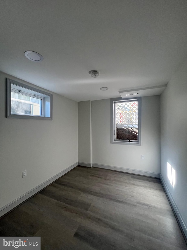 8107 Chester St, Takoma Park, MD 20912 - unfurnished room with plenty of natural light, wood finished floors, and baseboards