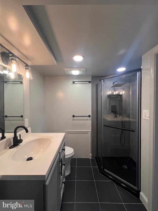 8107 Chester St, Takoma Park, MD 20912 - full bath with tile patterned flooring, vanity, a stall shower, toilet, and recessed lighting