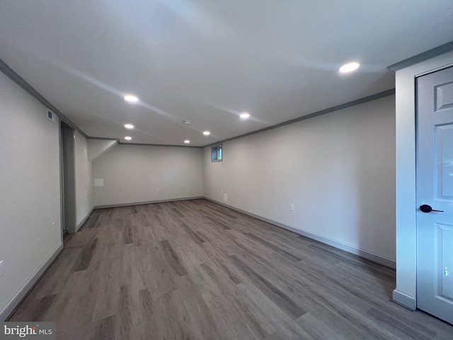 8107 Chester St, Takoma Park, MD 20912 - finished below grade area featuring wood finished floors, recessed lighting, and baseboards