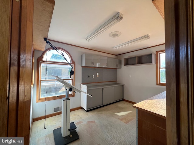 8107 Chester St, Takoma Park, MD 20912 - kitchen with healthy amount of natural light, baseboards, and light flooring