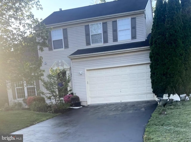 view of front of home featuring a garage and driveway
