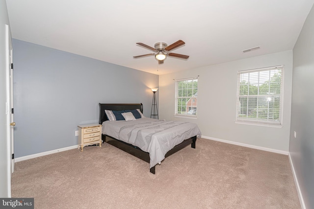 bedroom featuring baseboards, carpet, and a ceiling fan