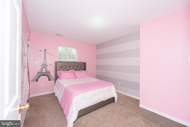 bedroom with carpet and baseboards
