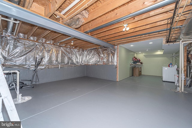 unfinished basement featuring washer / dryer