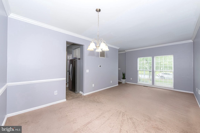 spare room with crown molding, a chandelier, carpet, and baseboards