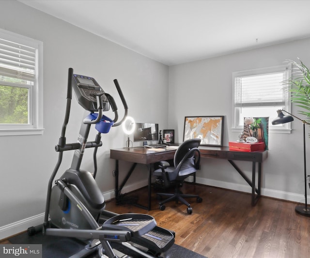 office with wood finished floors and baseboards