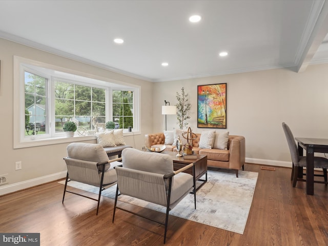 living room with ornamental molding, baseboards, recessed lighting, and wood finished floors