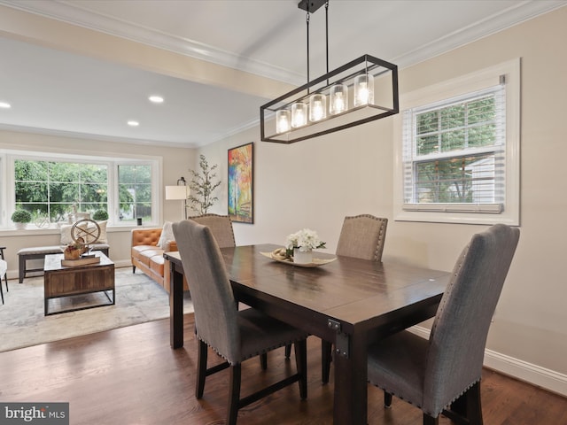 dining space featuring ornamental molding, plenty of natural light, wood finished floors, recessed lighting, and a chandelier