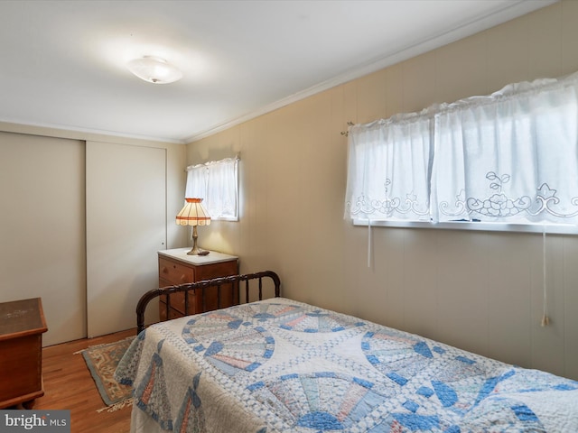 629 W Piedmont St, Keyser, WV 26726 - bedroom featuring wood finished floors, a closet, and crown molding