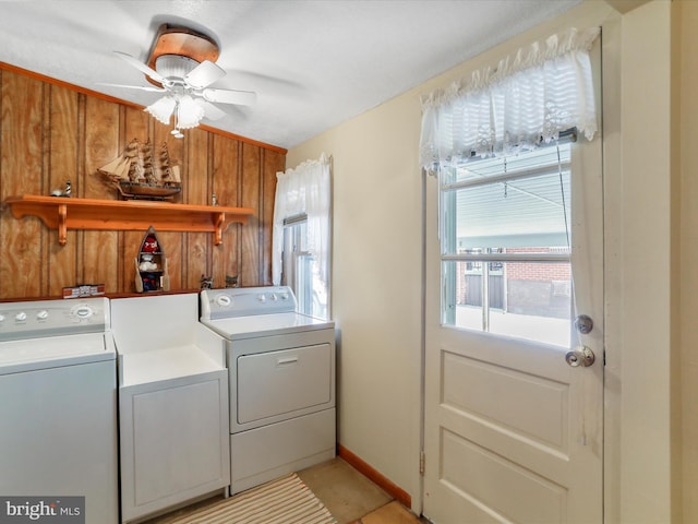 629 W Piedmont St, Keyser, WV 26726 - washroom with separate washer and dryer, healthy amount of natural light, a ceiling fan, and wood walls