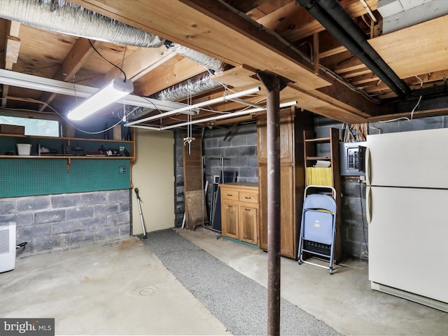 629 W Piedmont St, Keyser, WV 26726 - unfinished below grade area featuring freestanding refrigerator and concrete block wall