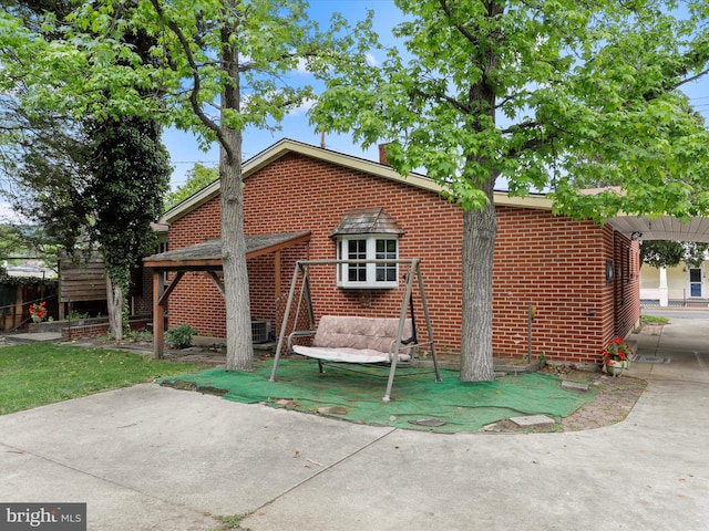 629 W Piedmont St, Keyser, WV 26726 - rear view of property with brick siding and a patio area