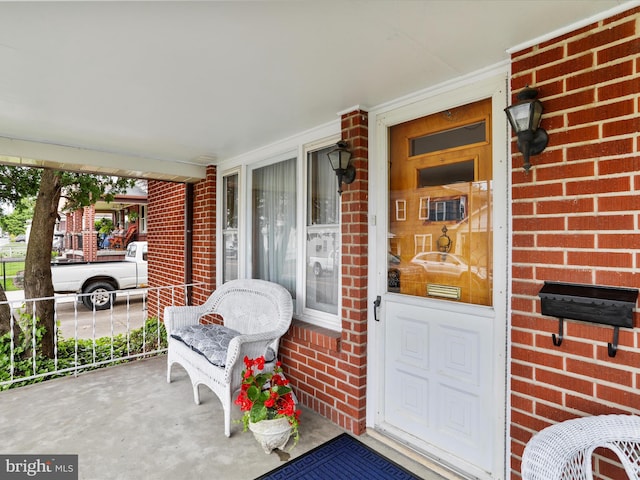 629 W Piedmont St, Keyser, WV 26726 - doorway to property featuring covered porch and brick siding
