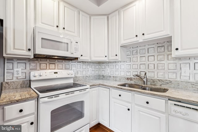 7702 Ousley Pl, Alexandria, VA 22315 - kitchen featuring white appliances, white cabinets, backsplash, and light stone countertops