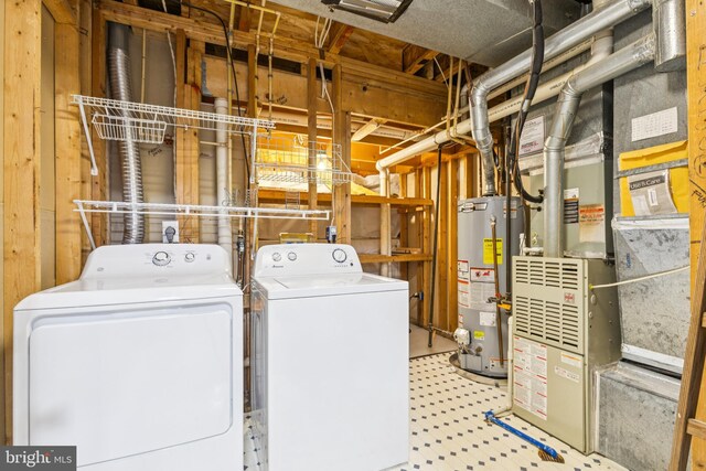 7702 Ousley Pl, Alexandria, VA 22315 - laundry room with gas water heater, washing machine and dryer, tile patterned floors, and heating unit