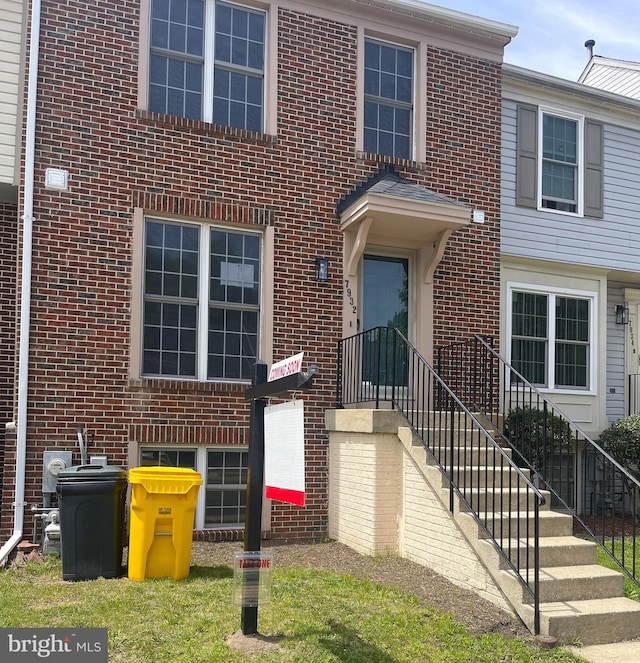 entrance to property with brick siding