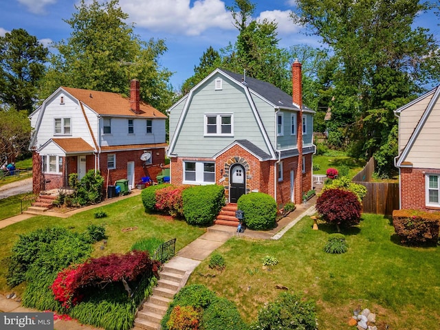 3902 Biddison Ln, Baltimore, MD 21206 - dutch colonial featuring a gambrel roof, brick siding, and a chimney