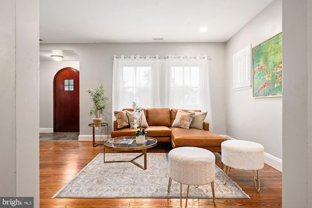 3902 Biddison Ln, Baltimore, MD 21206 - living room with arched walkways, wood finished floors, baseboards, and recessed lighting