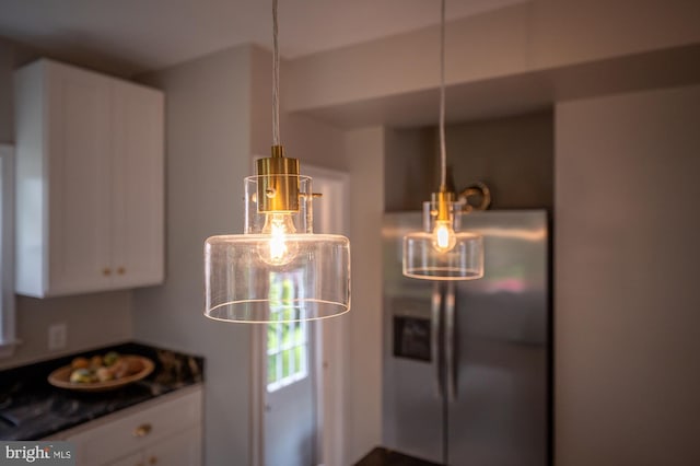 3902 Biddison Ln, Baltimore, MD 21206 - kitchen featuring stainless steel fridge, white cabinets, and dark countertops