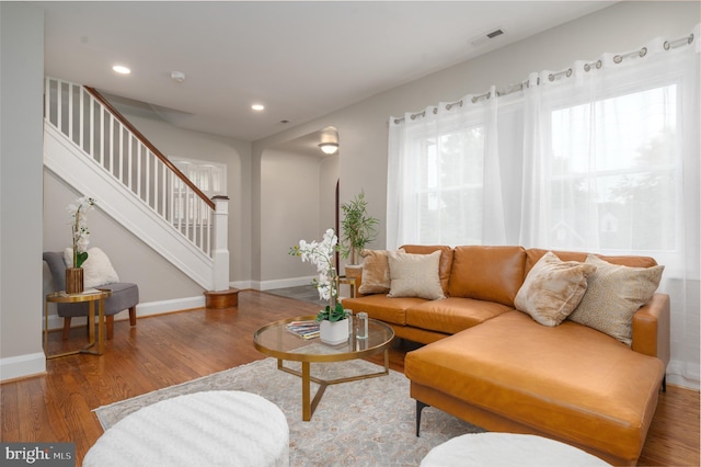 3902 Biddison Ln, Baltimore, MD 21206 - living area with wood finished floors, stairway, baseboards, and recessed lighting