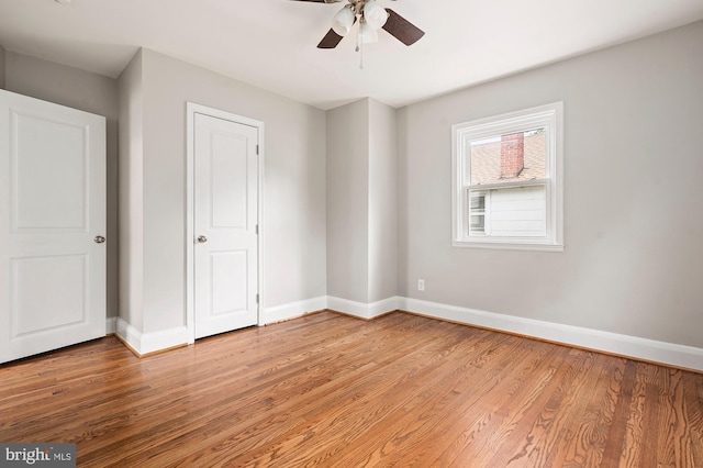 3902 Biddison Ln, Baltimore, MD 21206 - unfurnished bedroom featuring baseboards, light wood-style floors, and a ceiling fan