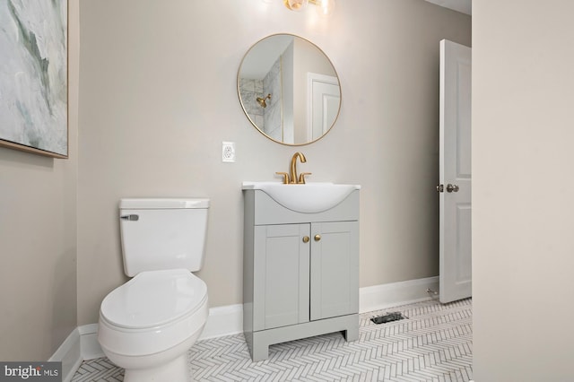 3902 Biddison Ln, Baltimore, MD 21206 - bathroom with baseboards, toilet, and vanity