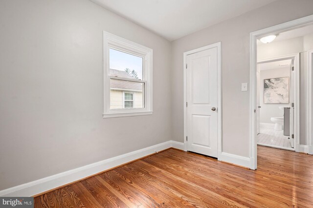 3902 Biddison Ln, Baltimore, MD 21206 - unfurnished bedroom with baseboards and light wood-style flooring