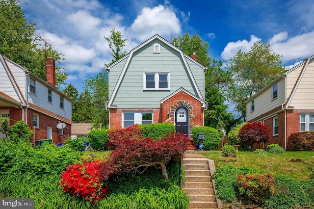 3902 Biddison Ln, Baltimore, MD 21206 - colonial inspired home with a gambrel roof, brick siding, and a chimney