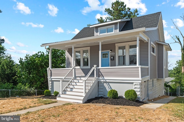 2704 Rueckert Ave, Baltimore, MD 21214 - bungalow featuring covered porch, a shingled roof, and fence
