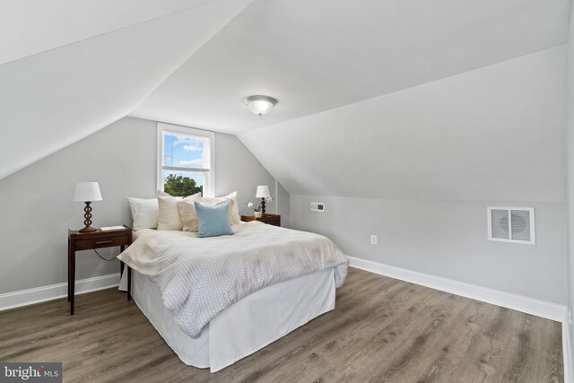 2704 Rueckert Ave, Baltimore, MD 21214 - bedroom with wood finished floors, baseboards, and vaulted ceiling