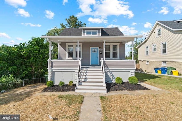 2704 Rueckert Ave, Baltimore, MD 21214 - bungalow with stairs, covered porch, and roof with shingles