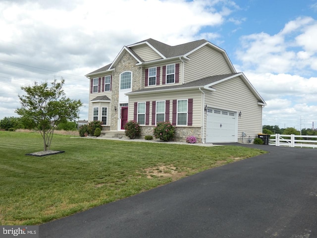 view of front of property featuring stone siding, asphalt driveway, a garage, and roof with shingles
