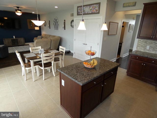kitchen with open floor plan, decorative backsplash, a ceiling fan, light tile patterned floors, and recessed lighting
