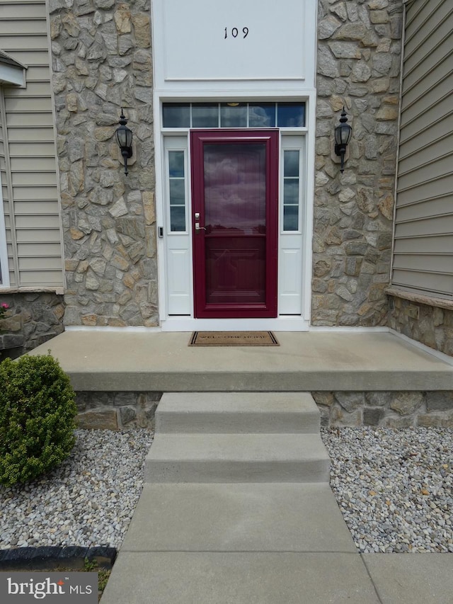 view of exterior entry with stone siding