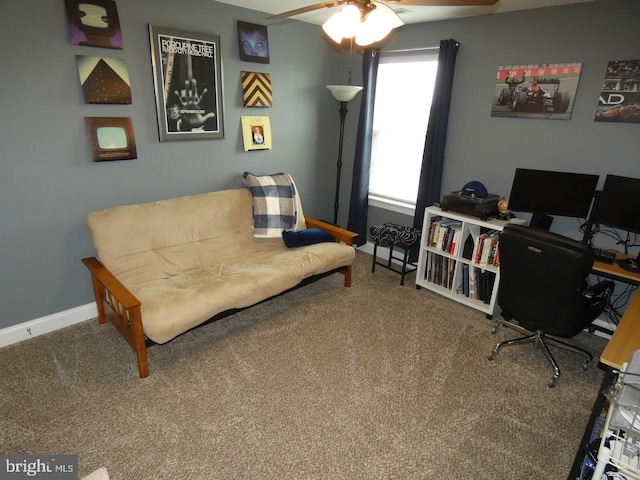 home office with a ceiling fan, carpet flooring, and baseboards