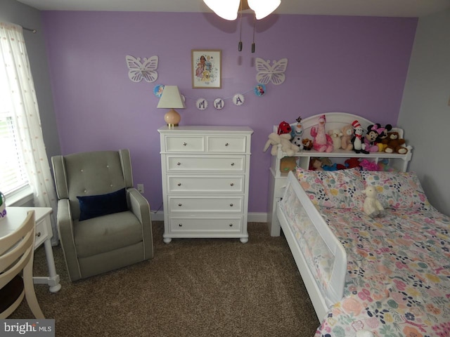 bedroom featuring dark colored carpet