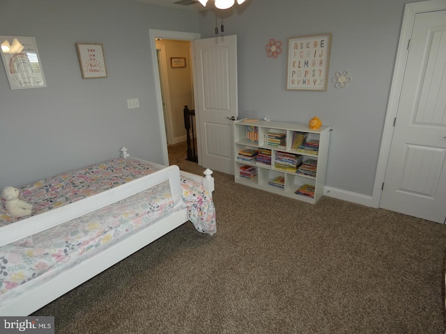 bedroom with carpet floors and baseboards