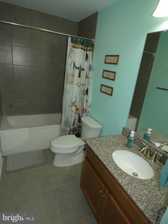 full bathroom with tile patterned floors, vanity, toilet, and shower / tub combo