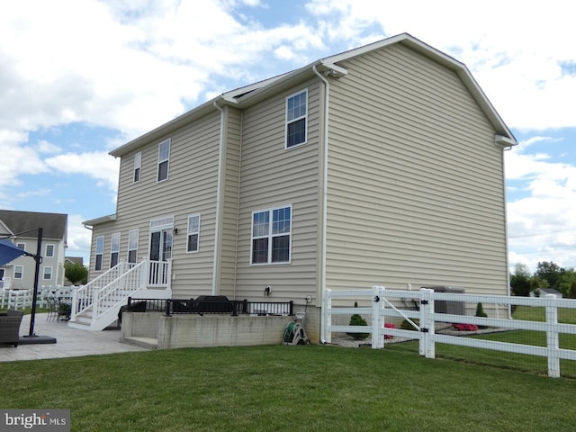 back of property featuring a patio