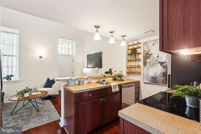 kitchen featuring light countertops, a sink, dishwasher, and dark wood-type flooring