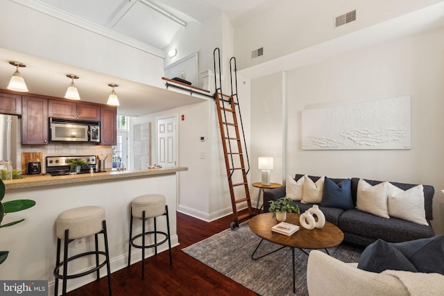 living room with dark wood-style flooring and baseboards