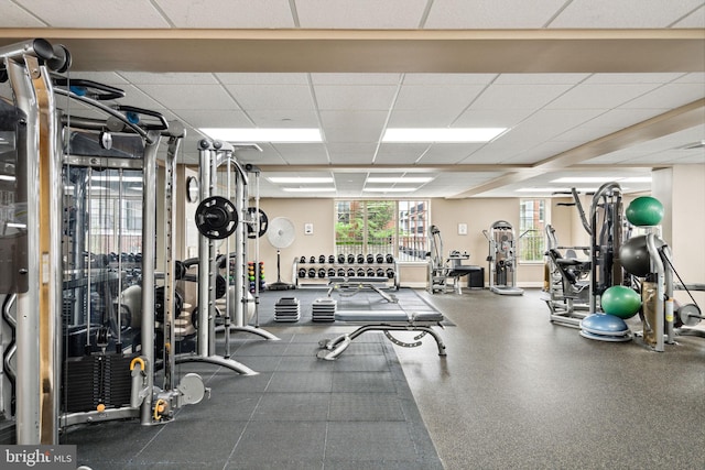 workout area featuring a drop ceiling
