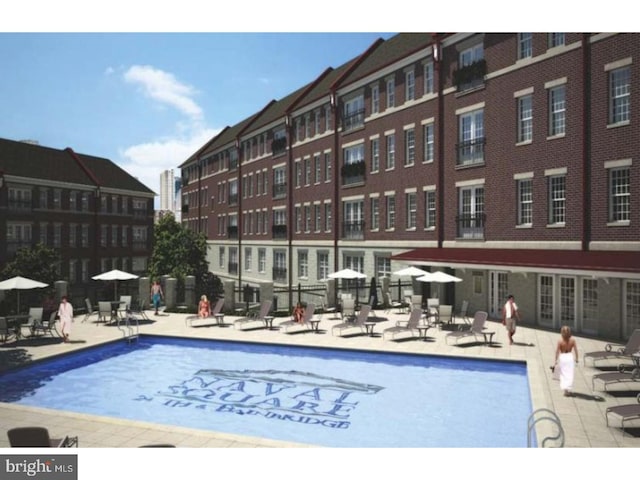 community pool with a patio area