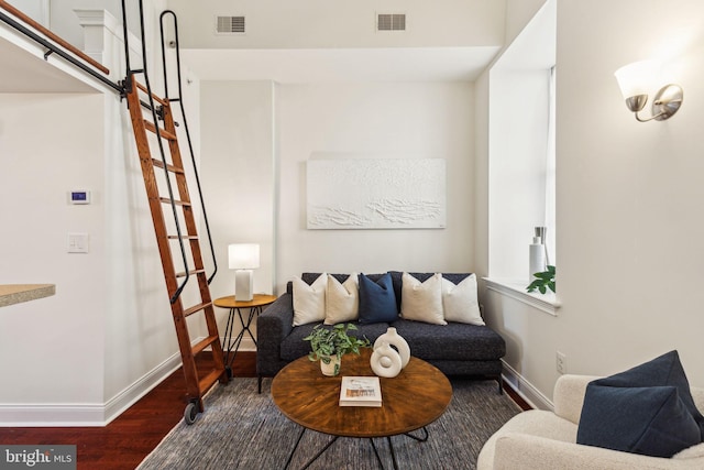 living room featuring wood finished floors and baseboards