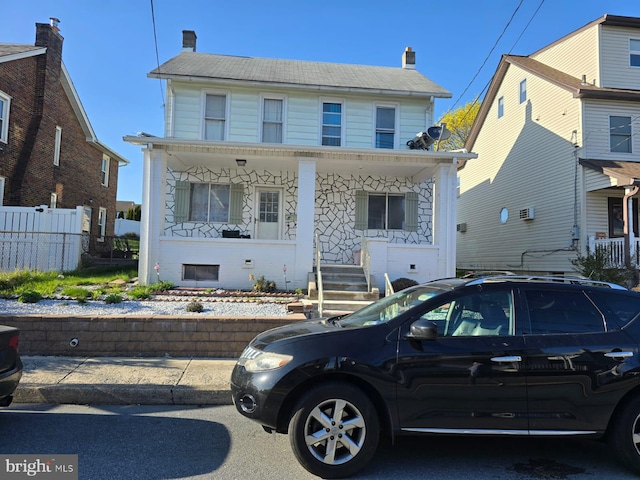 4527 Main St, Whitehall, PA 18052 - view of front of home with a porch, fence, and a chimney