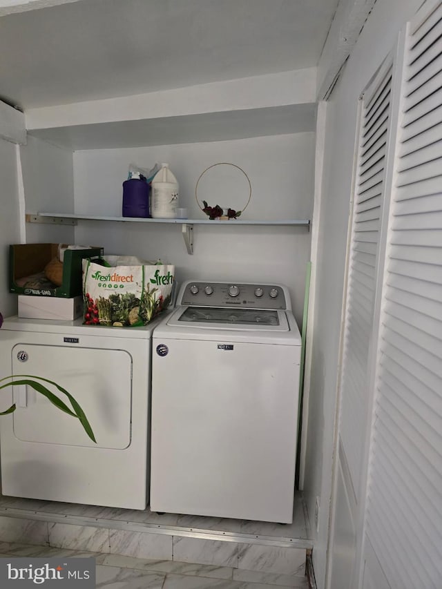 4527 Main St, Whitehall, PA 18052 - laundry area featuring washing machine and clothes dryer and marble finish floors