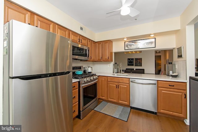 2706 Wimbledon Way, Blackwood, NJ 08012 - kitchen featuring stainless steel appliances, a sink, light countertops, and backsplash