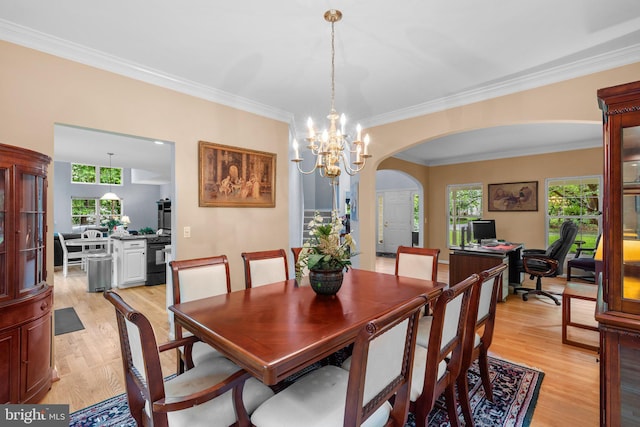 15066 Frederick Rd, Cooksville, MD 21723 - dining area with arched walkways, light wood-type flooring, a chandelier, ornamental molding, and healthy amount of natural light