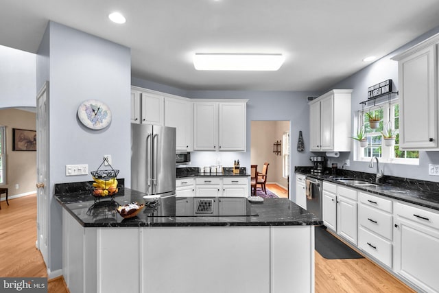 15066 Frederick Rd, Cooksville, MD 21723 - kitchen featuring stainless steel appliances, a sink, white cabinets, light wood-style flooring, and recessed lighting